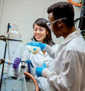 Student in lab with professor