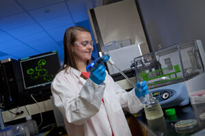 Student works on cell plate preparation.